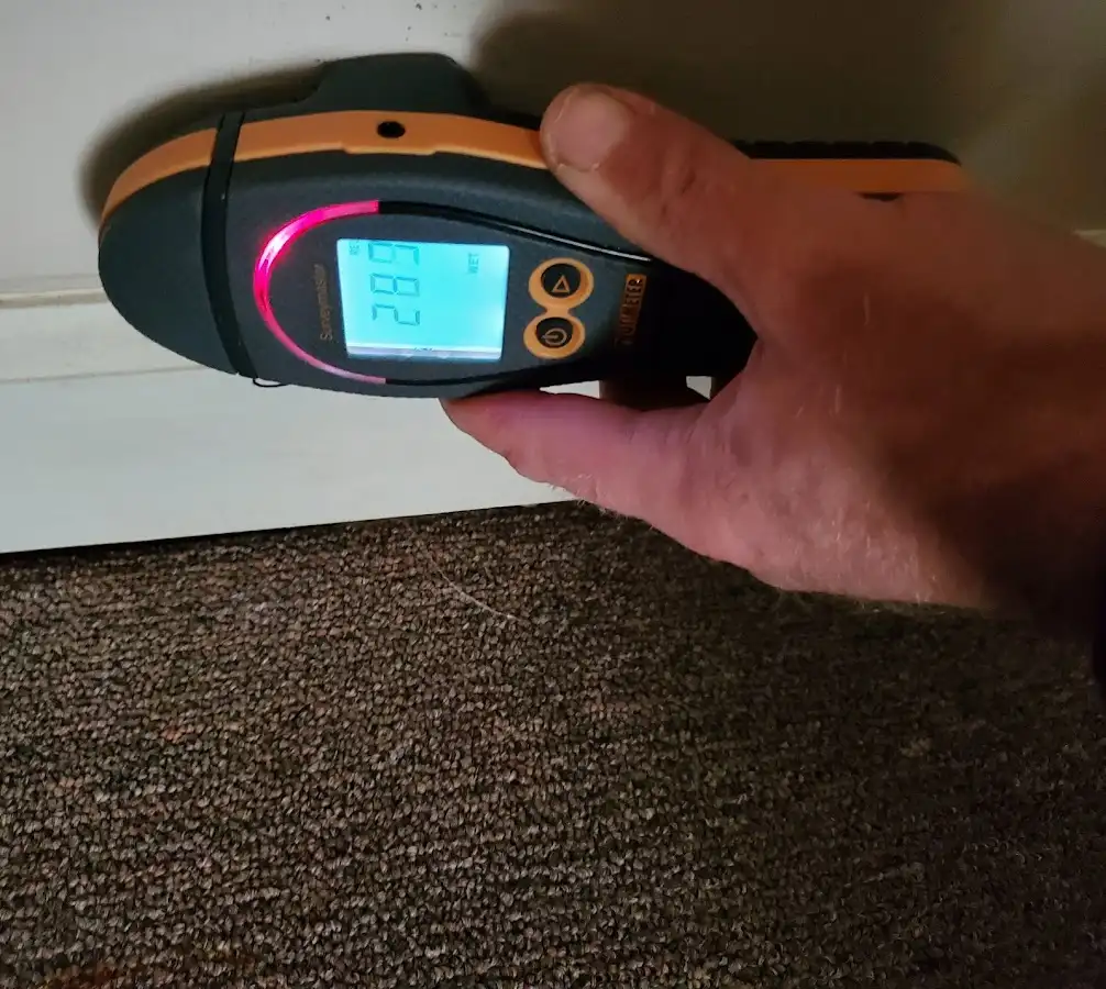 Moisture detection at baseboard during Burst Pipe Cleanup in Powell